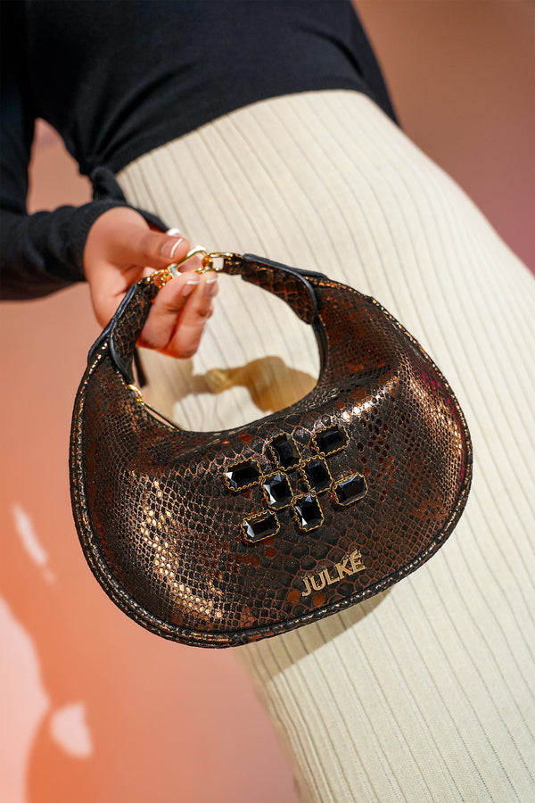 Women's leather mini hobo bag in copper black colour with 3d reptile texture and unique clip-on handle by JULKE 