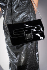 Womens patent leather clutch bag in black colour with twist lock and detachable silver chain strap by JULKE