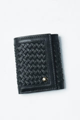 Womens leather trifold wallet in black colour with braiding and metal logo by JULKE