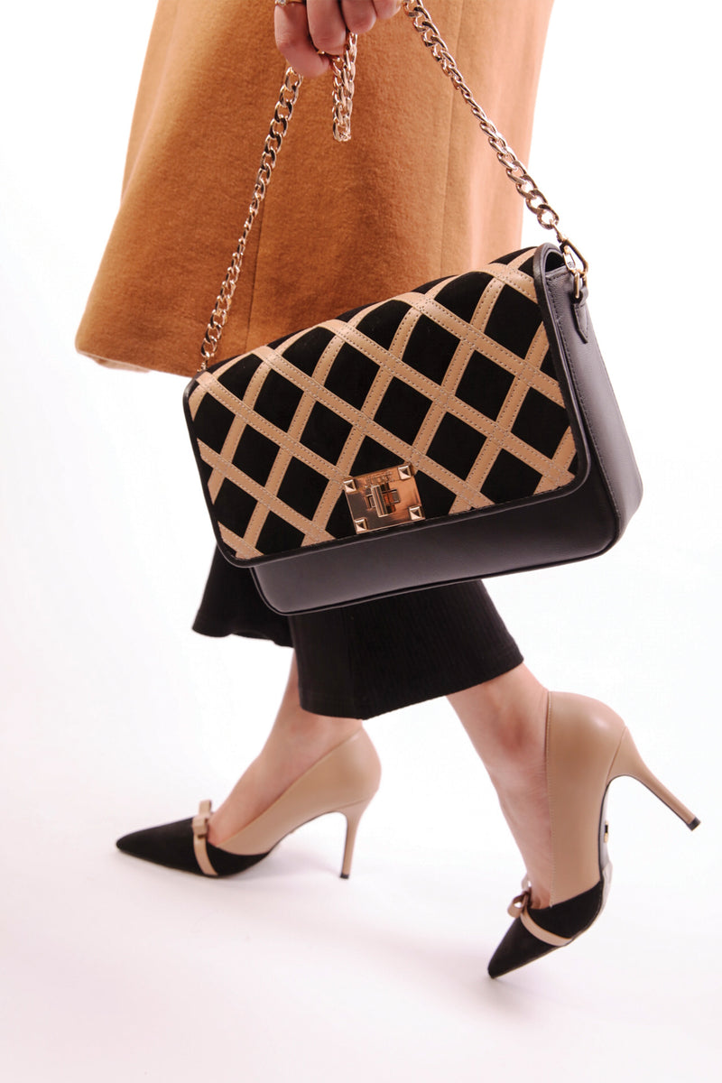 Womens leather shoulder bag in light brown and black colour with quilted straps and gold chain by JULKE