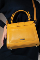 Womens leather top handle bag in yellow colour with reptile texture and detachable shoulder strap by JULKE