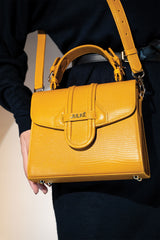 Womens leather top handle bag in yellow colour with reptile texture and detachable shoulder strap by JULKE