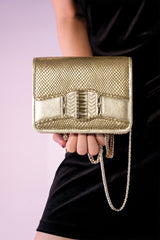 Women's leather reptile texture shoulder clutch bag in gold colour with rhinestones and detachable golden shoulder chain by JULKE. 