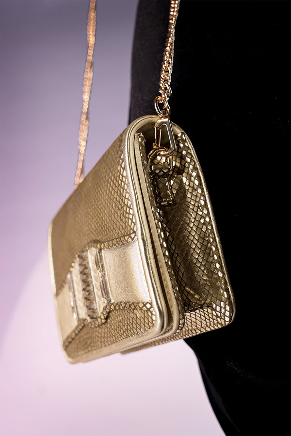 Women's leather reptile texture shoulder clutch bag in gold colour with rhinestones and detachable golden shoulder chain by JULKE. 