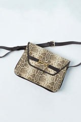 Womens leather shoulder bag in light beige colour with snake print and adjustable shoulder strap by JULKE