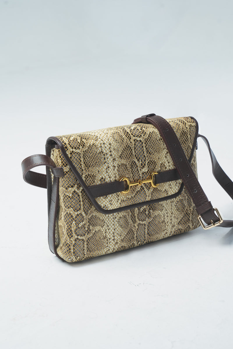 Womens leather shoulder bag in light beige colour with snake print and adjustable shoulder strap by JULKE