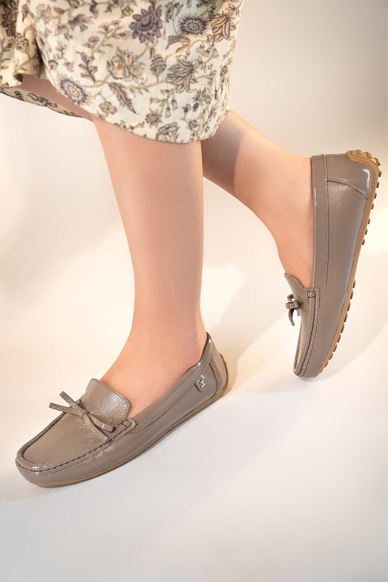 Women's winter leather moccasins in grey colour with glossy finish and leather bow by JULKE