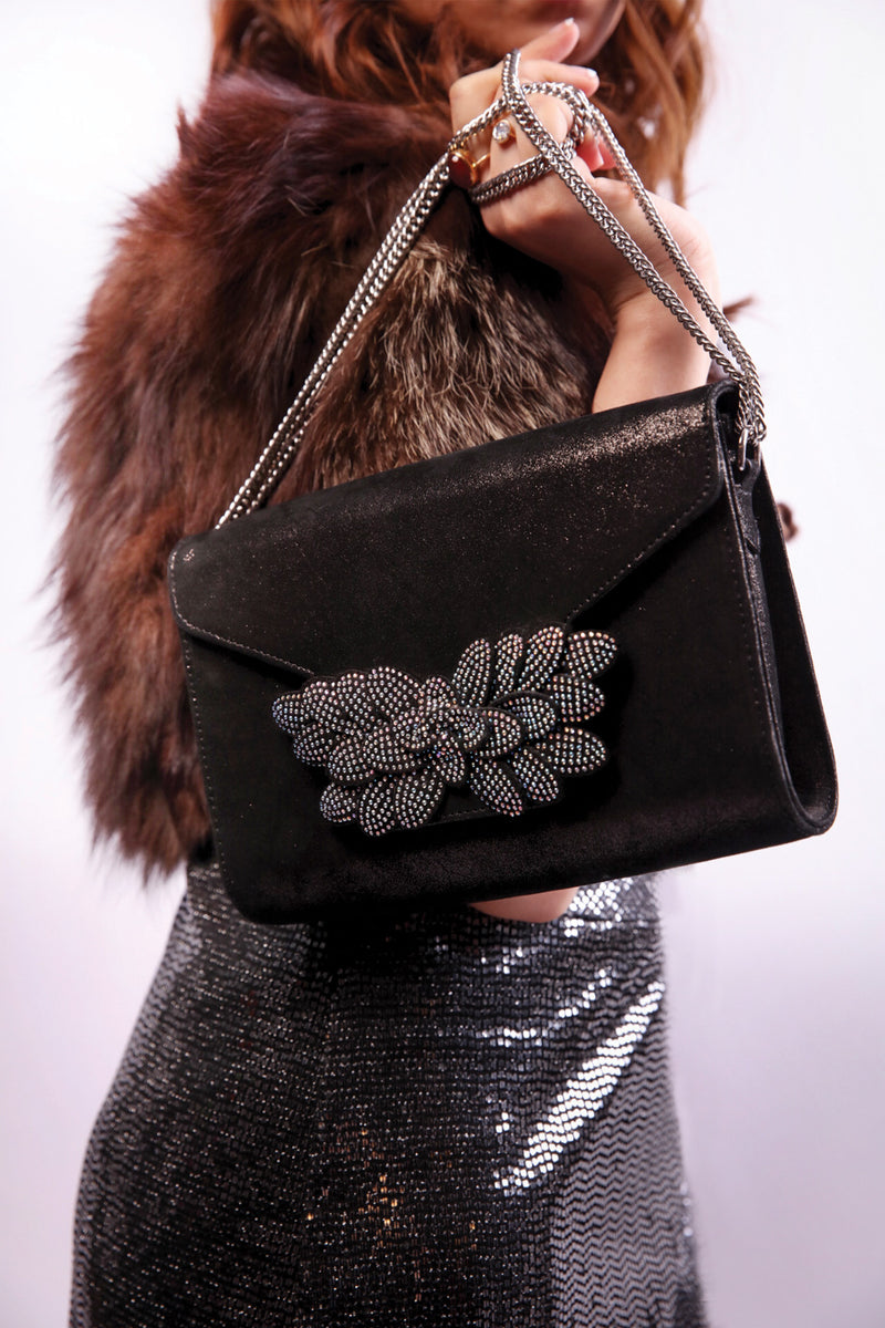 Womens leather shoulder clutch bag in shiny black colour with diamante leaf brooch and silver chain by JULKE