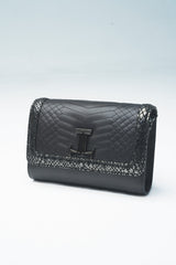 Womens leather shoulder bag in black colour with snake texture border and silver chain and logo by JULKE