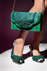 Women satin slingback heels in green colour with peep toe and diamante leaf ornament and matching bag by JULKE