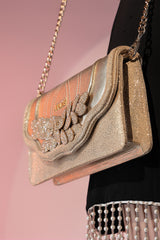 Womens suede leather envelope clutch in pale gold colour with shiny foil and detachable golden shoulder chain by JULKE