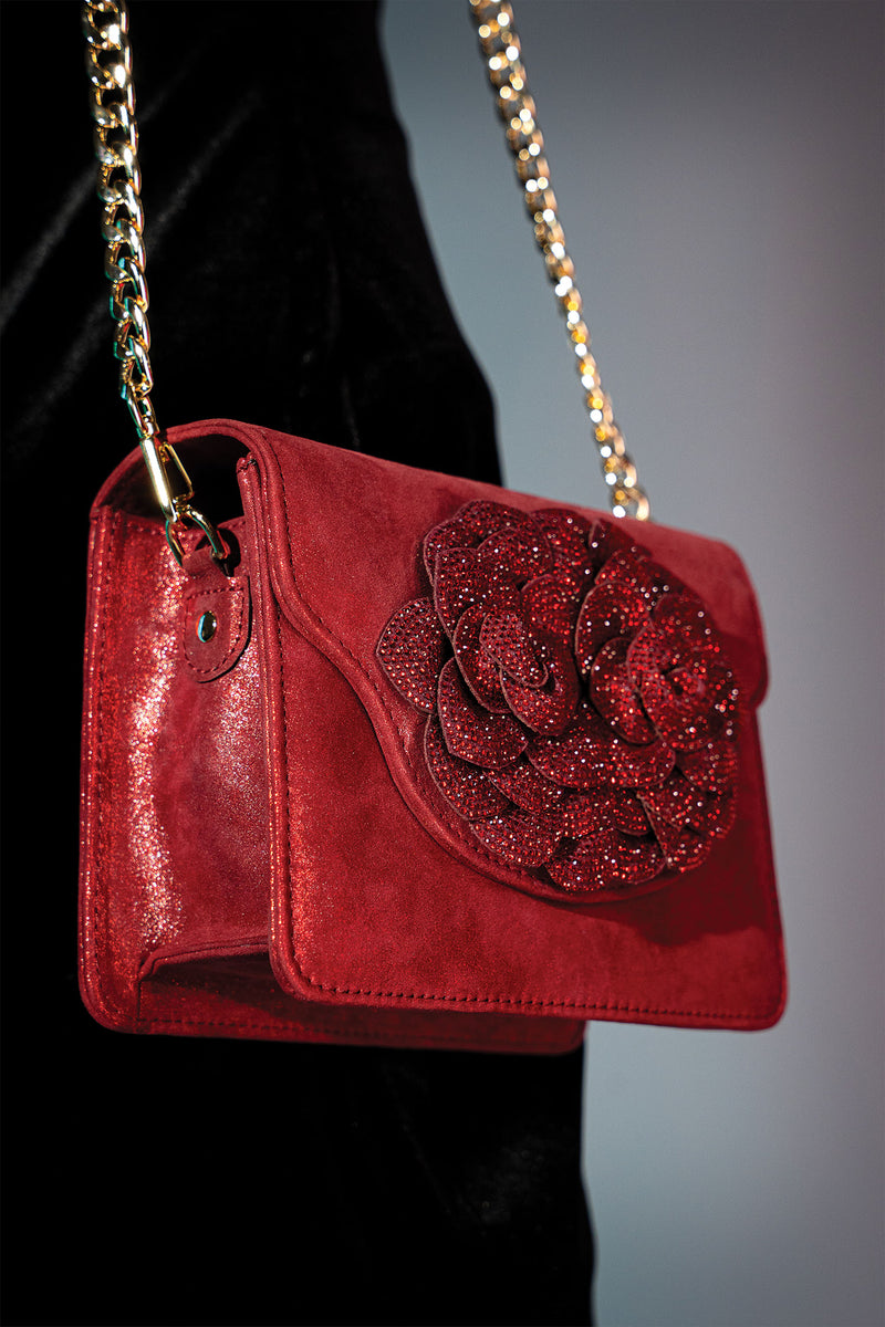 Womens suede leather shoulder bag in red glitter colour with big diamante flower brooch and detachable golden chain by JULKE