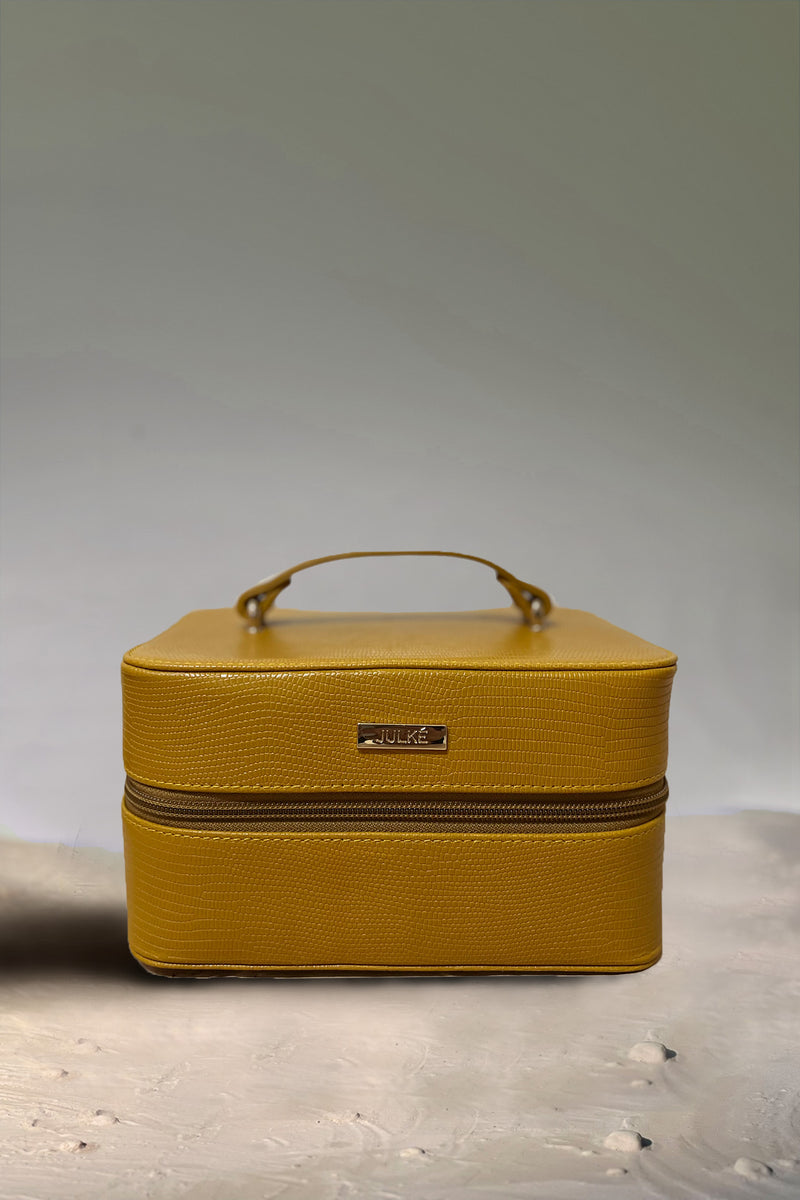 Women's leather travel bag in mustard yellow colour for accessories and makeup in square shape with top handle by JULKE