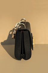 Women's leather top handle bag in black colour with accordion gusset and golden chain handle by JULKE