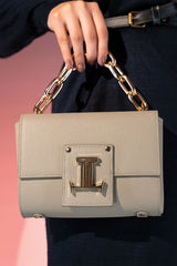 Women's leather top handle bag in grey colour with accordion gusset and golden chain handle by JULKE