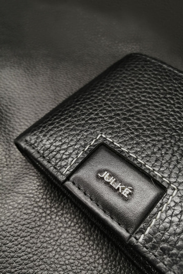 Mens leather bifold wallet in black colour with croc texture and white contrast stitch by JULKE