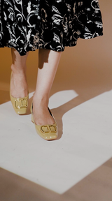 Womens leatherite block heels in light yellow patent with square toe and logo buckle by JULKE